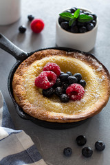 Dutch Baby pancake with fresh berries and mint
