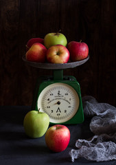 Colorful apples on vintage scales. Title on scales 