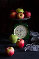 Colorful apples on vintage scales. Title on scales 
