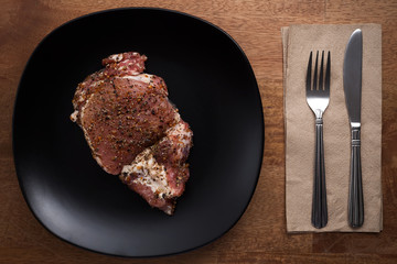 raw pork steak still life on wooden background