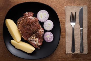 raw pork steak still life on wooden background