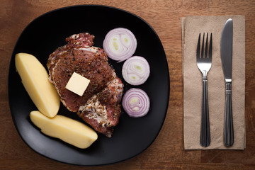 raw pork steak still life on wooden