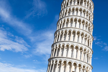 The Tower of Pisa against the background of the sky with clouds