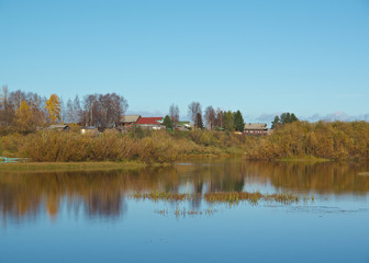 Fall River, reflected in the water autumn trees.