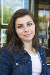 Portrait of girl in jacket at summer day