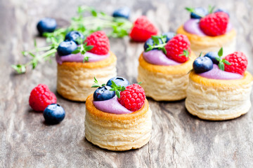 Obraz na płótnie Canvas puff pastry stuffed with soft blueberry curd with berries and t
