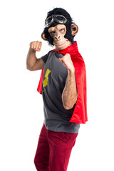 Superhero monkey man giving a punch © luismolinero