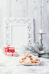 Christmas composition with gingerbread on wooden background