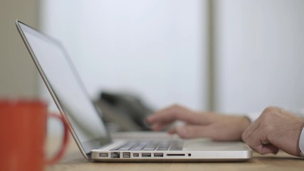 Businessman closes laptop and finishes work