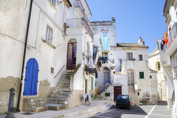 white building blue door italian village Rodi Gargano