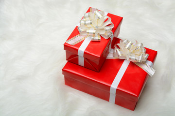 Two red boxes with gifts