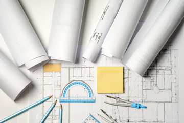 Workplace of architect - rolls and plans.