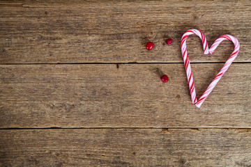 
 background with candy canes in the shape of heart