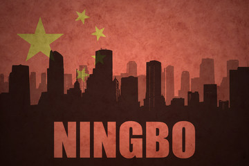 abstract silhouette of the city with text Ningbo at the vintage chinese flag background