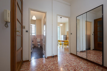 Entrance in normal apartment with tiled floor