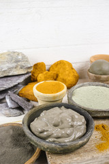Ancient minerals - ochre, green  and blue clay powder and mud mask
