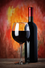 bottle and glass of red wine