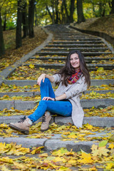 smiling girl sitting on the stairs