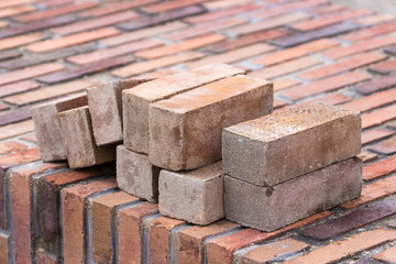 New brick wall with some loose bricks