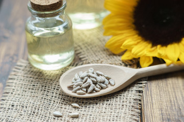 till life with oil bottles, sunflower and seeds