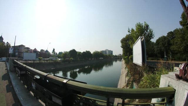 Bridge Over River In Downtown Bucharest, Traffic, Sunny Day, Pan, Fish Eye Lens