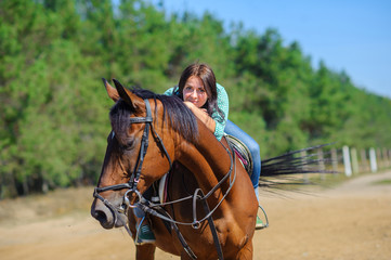 Fototapeta premium girl astride a horse