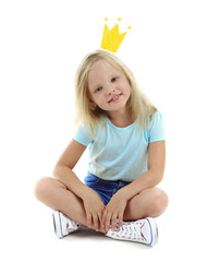 Cute little girl with princess crown drawing above head on white background. © Africa Studio