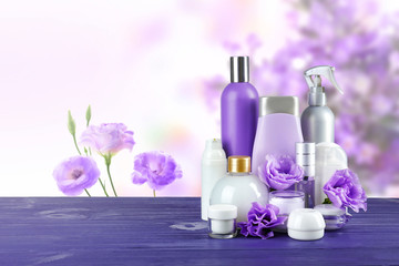 Obraz na płótnie Canvas Set of body care products on eustoma flowers background