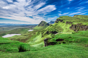 Fototapeta na wymiar Stunning view from Quiraing to valley in Scotland at summer, United Kingdom