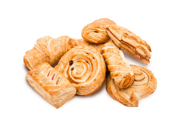 variety of fresh pastries on white background