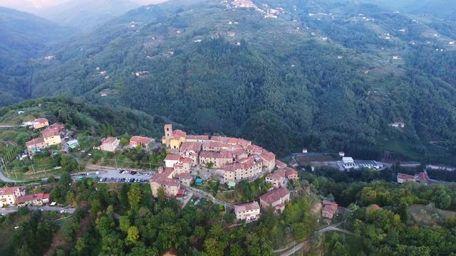 Aerial shot, gorgeous classic small italian village on the hill flyover, in middle of the green nature, made with drone.mp4