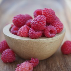 Raspberries wooden bowl