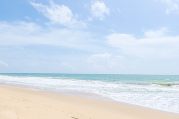 Fototapeta na wymiar Empty sandy beach with sea under blue sky in thailand