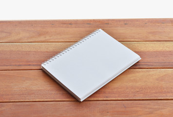 empty white paper page of binder notebook on  table and white background