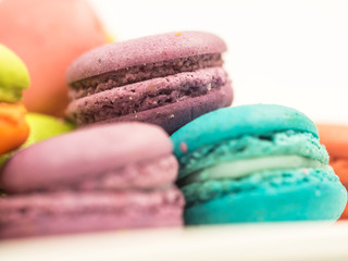 A french sweet delicacy, macaroons variety closeup.macaroon colourful texture, soft focus