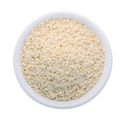 top view of white sesame in the white bowl isolated on white