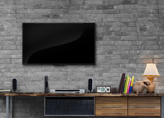 Tv on brick wall with wooden table media furniture