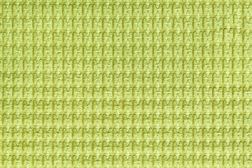 Light green background from soft fleecy fabric close up. Texture of textiles macro.