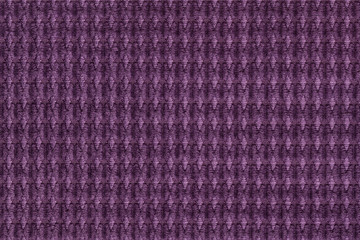 Dark purple background from soft fleecy fabric close up. Texture of textiles macro.