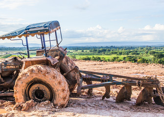 The image of the tractor in the mud
