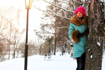 young woman tree winter