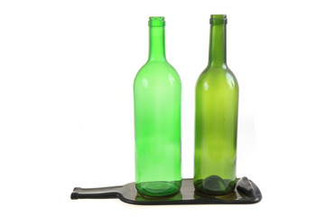 green glass bottles with one flat bottle