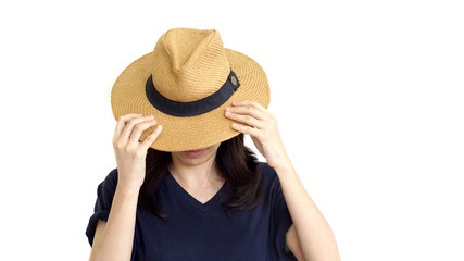 Casual South East Asian girl wearing hat hiding face