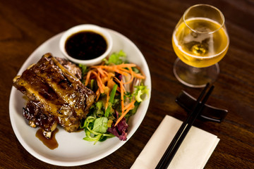 Roasted lamb chops with soy sauce and vegetables