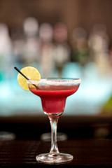 Cocktail with lemon slice in glass - focus concept