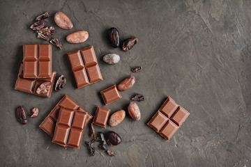 pieces of chocolate bar and cocoa beans