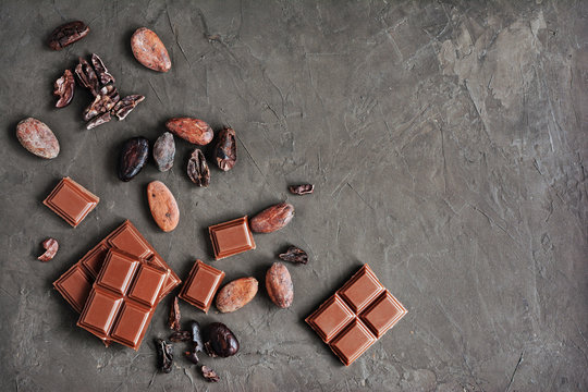 Pieces Of Chocolate Bar And Cocoa Beans