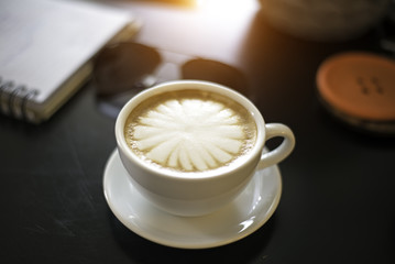 Coffee cup on wooden table ,soft focus