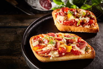 Two servings of pizza bread on pan