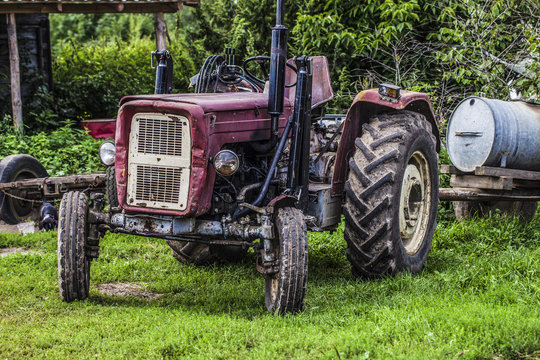 old red tractor on the grass